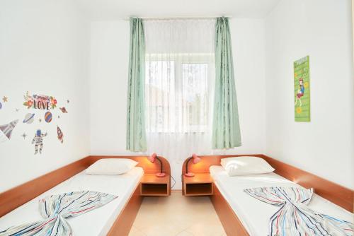 Postel nebo postele na pokoji v ubytování BulgariaVilla - Villa Gardenia