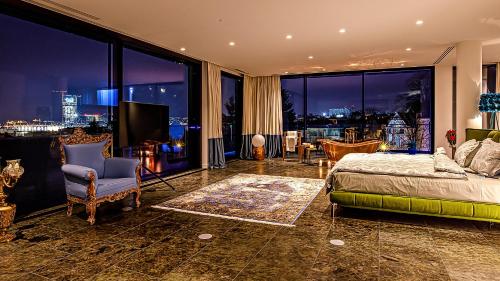 a bedroom with a bed and a view of a city at The Babe Boutique Hotel in Belgrade