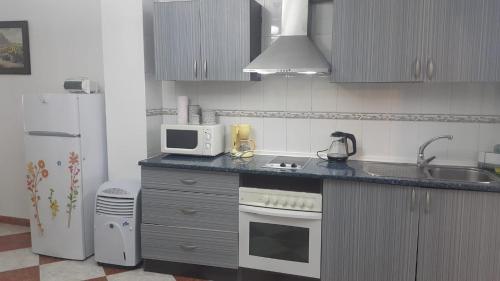Kuchyň nebo kuchyňský kout v ubytování Apartamento El Sol