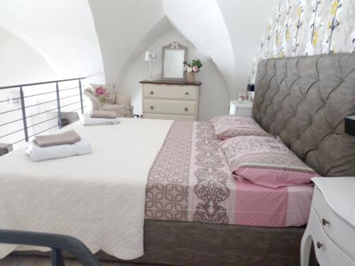 A bed or beds in a room at Charming sea-view house in Ostuni with terrace