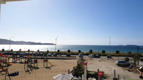 a parking lot with a view of the ocean at 3 bedrooms appartement with sea view furnished terrace and wifi at Nigran in Nigrán