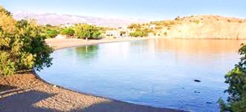 a large pool of water in the middle of a lake at Picturesque Villa in Limnos + Enclosed Garden + Sea View in Límnos