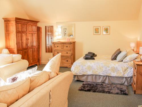 a living room with two beds and a couch at Stiperstones View in Shrewsbury