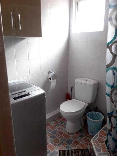 a small bathroom with a toilet and a sink at Modern Apartment in Melville, Pool View, 120 m² in Grand Gaube