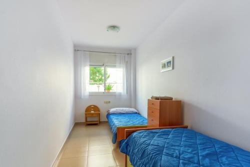 Katil atau katil-katil dalam bilik di 2 bedrooms appartement at Lloret de Mar 500 m away from the beach with city view shared pool and furnished terrace