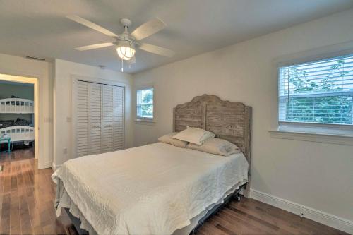a bedroom with a bed and a ceiling fan at Bright Sarasota Bungalow - 5 Mi to Siesta Beach! in Sarasota