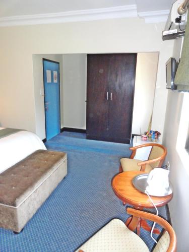 Katil atau katil-katil dalam bilik di Constantia Manor Guest House