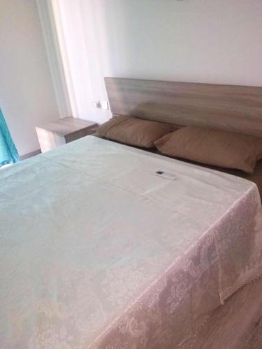 a large bed in a bedroom with a large mattress at Bright apartment with sea view in Għajnsielem - 120 sqm in Għajnsielem