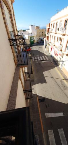 an empty street with two balconies on a building at Spacious apartment with mountain view in Tabernas, 99 sqm in Tabernas