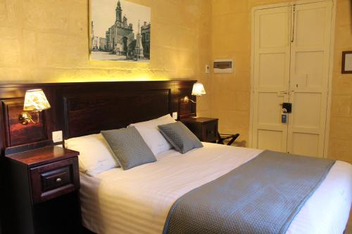 Postel nebo postele na pokoji v ubytování Palazzino Nina Boutique Hotel