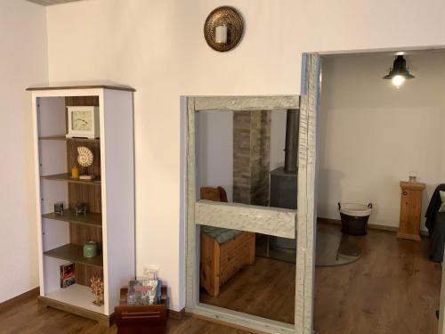a mirrored door in a room with a mirror at Villa Ammonit in Pottenstein