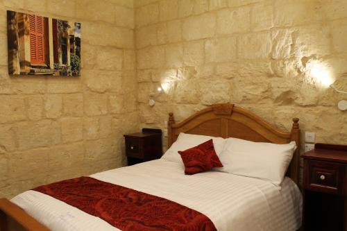 Postel nebo postele na pokoji v ubytování Palazzino Nina Boutique Hotel