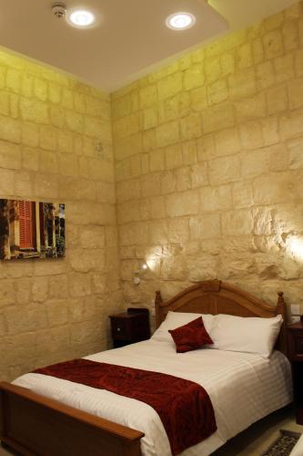 Postel nebo postele na pokoji v ubytování Palazzino Nina Boutique Hotel