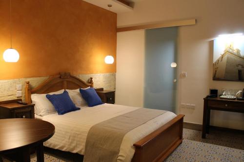 Postel nebo postele na pokoji v ubytování Palazzino Nina Boutique Hotel
