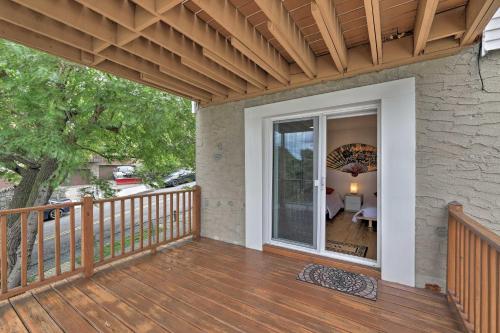 a porch of a home with a wooden deck at Yonkers Apt with Balcony Walk to Train Station! in Yonkers