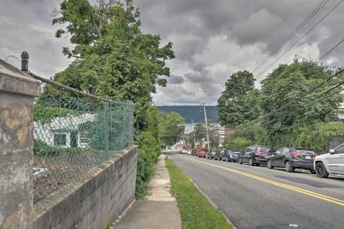 a street with cars parked on the side of the road at Yonkers Apt with Balcony Walk to Train Station! in Yonkers