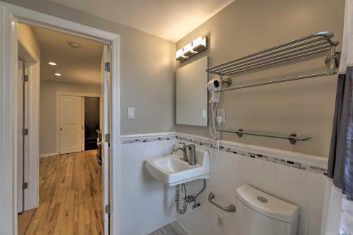 a bathroom with a sink and a toilet at Yonkers Apt with Balcony Walk to Train Station! in Yonkers