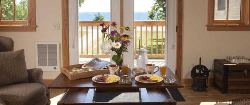 a living room with a table with food on it at Lake Orchard Farm Retreat in Sheboygan