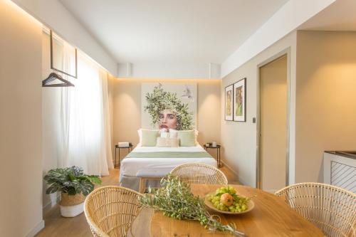 Postel nebo postele na pokoji v ubytování Artree Suites