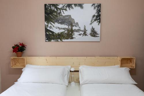 מיטה או מיטות בחדר ב-Ibón - sencillo y económico, con wifi