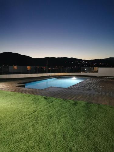 a swimming pool on top of a building at Maximos Luxury Villa with Pool -BREAKBOOKING-CY in Limassol