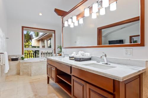 a bathroom with a sink and a mirror at San Ignacio Resort Hotel in San Ignacio
