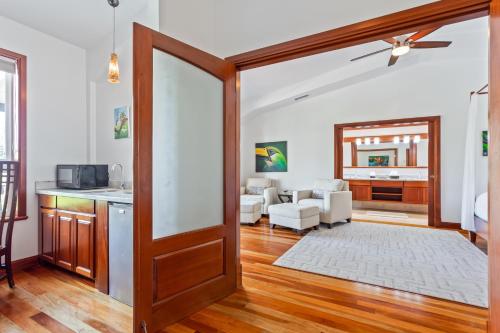 a living room with a door open to a living room at San Ignacio Resort Hotel in San Ignacio