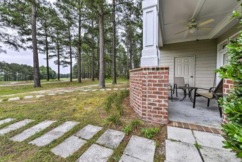 a house with a patio with a table at Resort-Style CondoandSuite on Golf Course with Pool! in Spring Lake