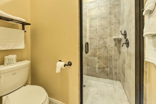 a bathroom with a shower with a toilet at Resort-Style Condo on Golf Course with Pool Access in Spring Lake