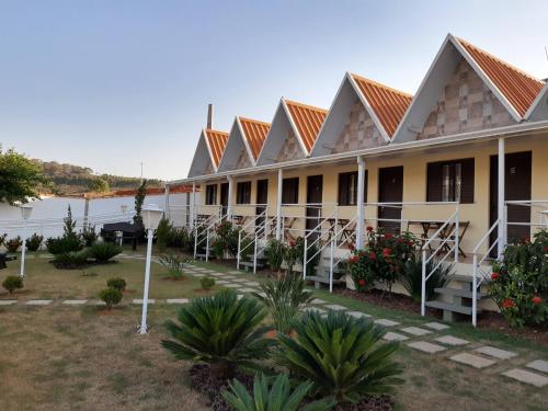a row of buildings with orange roofs at Pousada Canto dos Canários in Socorro