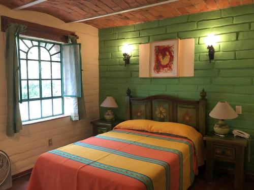 Postel nebo postele na pokoji v ubytování Casa del Retoño