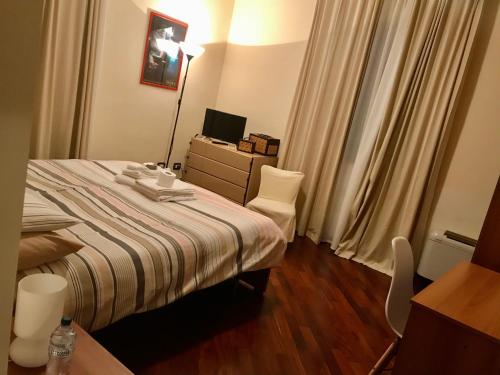 Postel nebo postele na pokoji v ubytování Dino's B&B