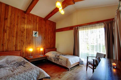 מיטה או מיטות בחדר ב-Villa Four Seasons