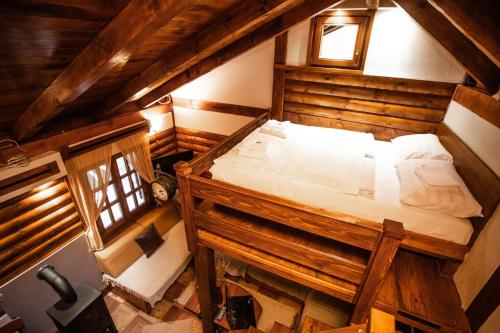 an overhead view of a bed in an attic at Rzav, ti i ja. in Arilje