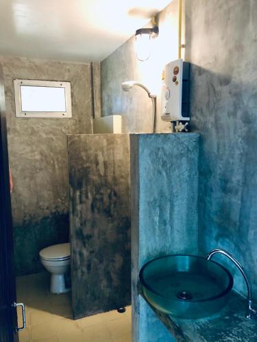a bathroom with a sink and a toilet at Paradise Cottage in Ko Chang