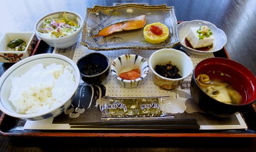 a tray with a variety of food on a table at Tabist Hotel Tetora Kitakyushu in Kitakyushu