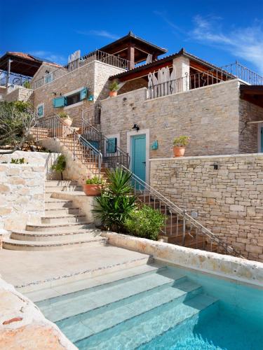 a house with stairs leading to a swimming pool at Villa Kamen Blue in Vela Luka