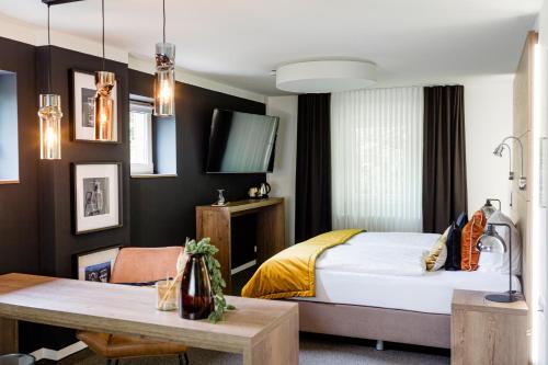 Postel nebo postele na pokoji v ubytování Hotel Restaurant Zwergschlösschen