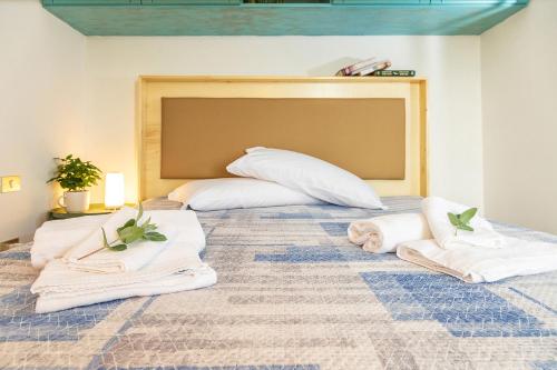 En eller flere senge i et værelse på Casa Cala Luna