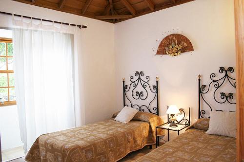 Een bed of bedden in een kamer bij Puente Roto