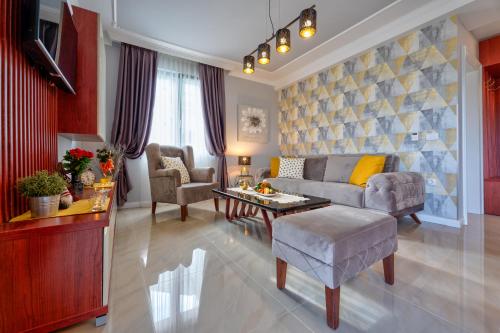 a living room with a couch and a table at Adonis 201 in Zlatibor