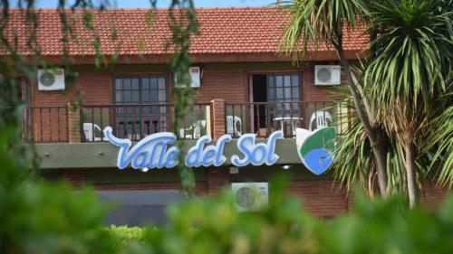 a sign on the side of a building at Hotel Valle Del Sol in Merlo