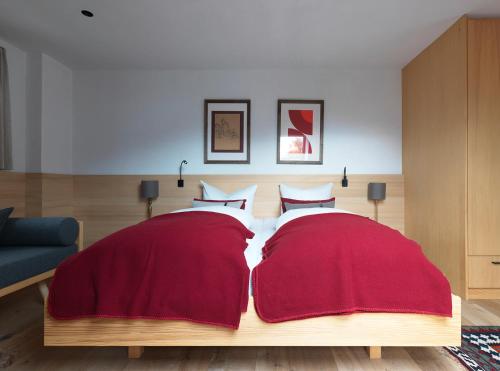 Una cama o camas en una habitación de das Stieger