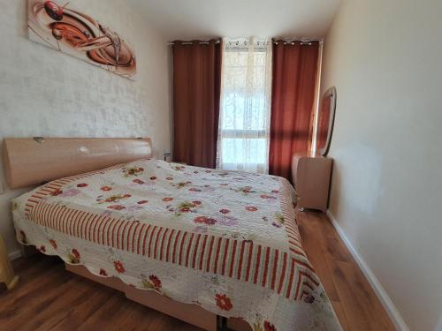 a bedroom with a bed and a window at Sea View Deluxe in Bat Yam