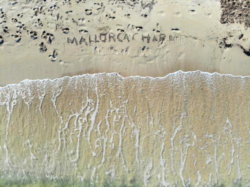an overhead view of the beach with writing in the sand at 126 Finca Son Tresco ETV4382 by Mallorca Charme in Búger