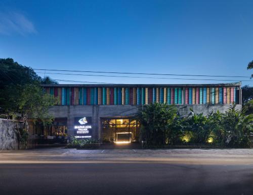 a building with a colorful facade at night at Mapakada Village - Mahiyanganaya in Mahiyangana