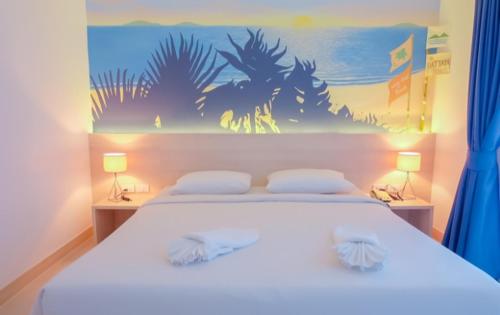 Ένα ή περισσότερα κρεβάτια σε δωμάτιο στο Flipper House Hotel - SHA Extra Plus