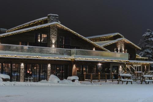 a large building in the snow at night at Hotell Viktors in Sälen