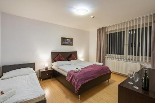Postel nebo postele na pokoji v ubytování Wili Tatry Apartments