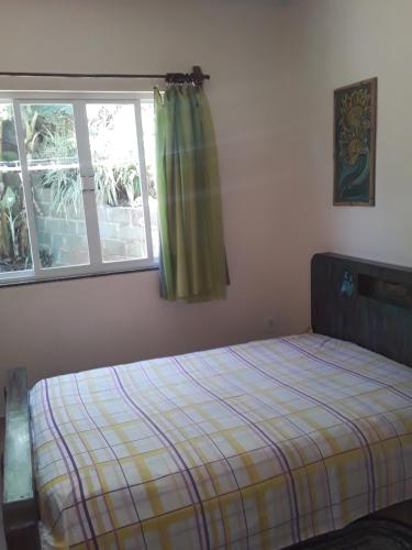 Postel nebo postele na pokoji v ubytování Casa aconchegante em estilo rústico